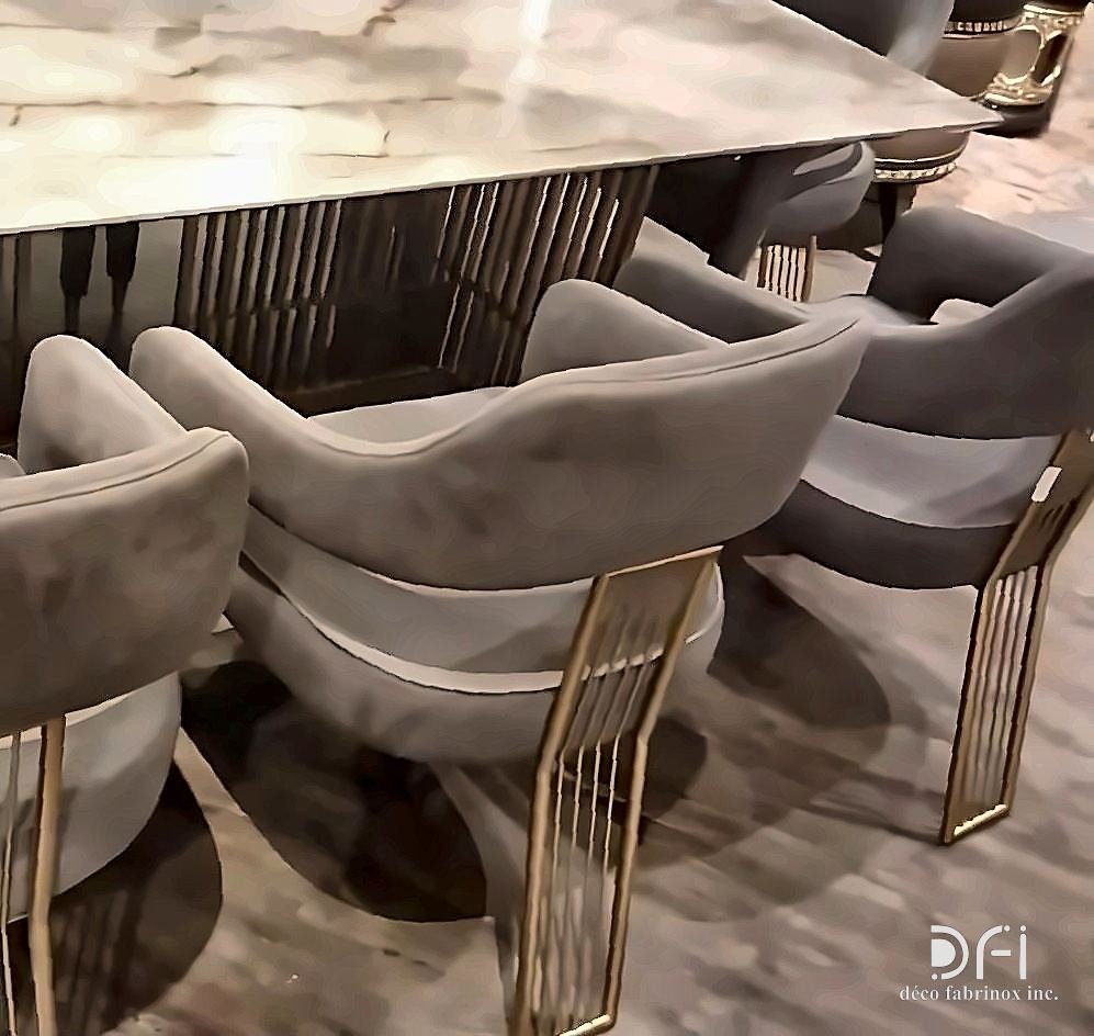 Brass-framed dining chairs around a marble table
