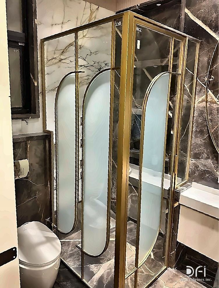 Brass and glass shower cubicle in a luxury bathroom