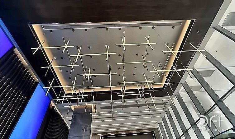 Brass grid feature suspended in a lobby ceiling