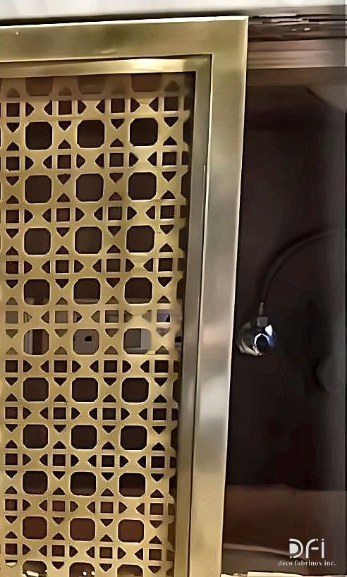 Brass lattice screen set into an interior wall