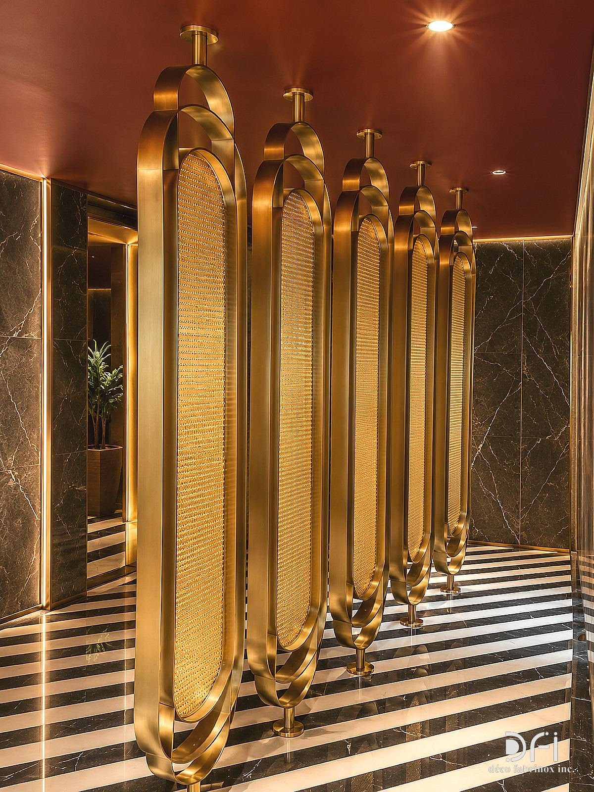 Row of brass oval partitions in a washroom