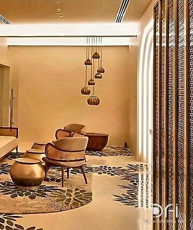 Brass perforated partition dividing a hotel lounge