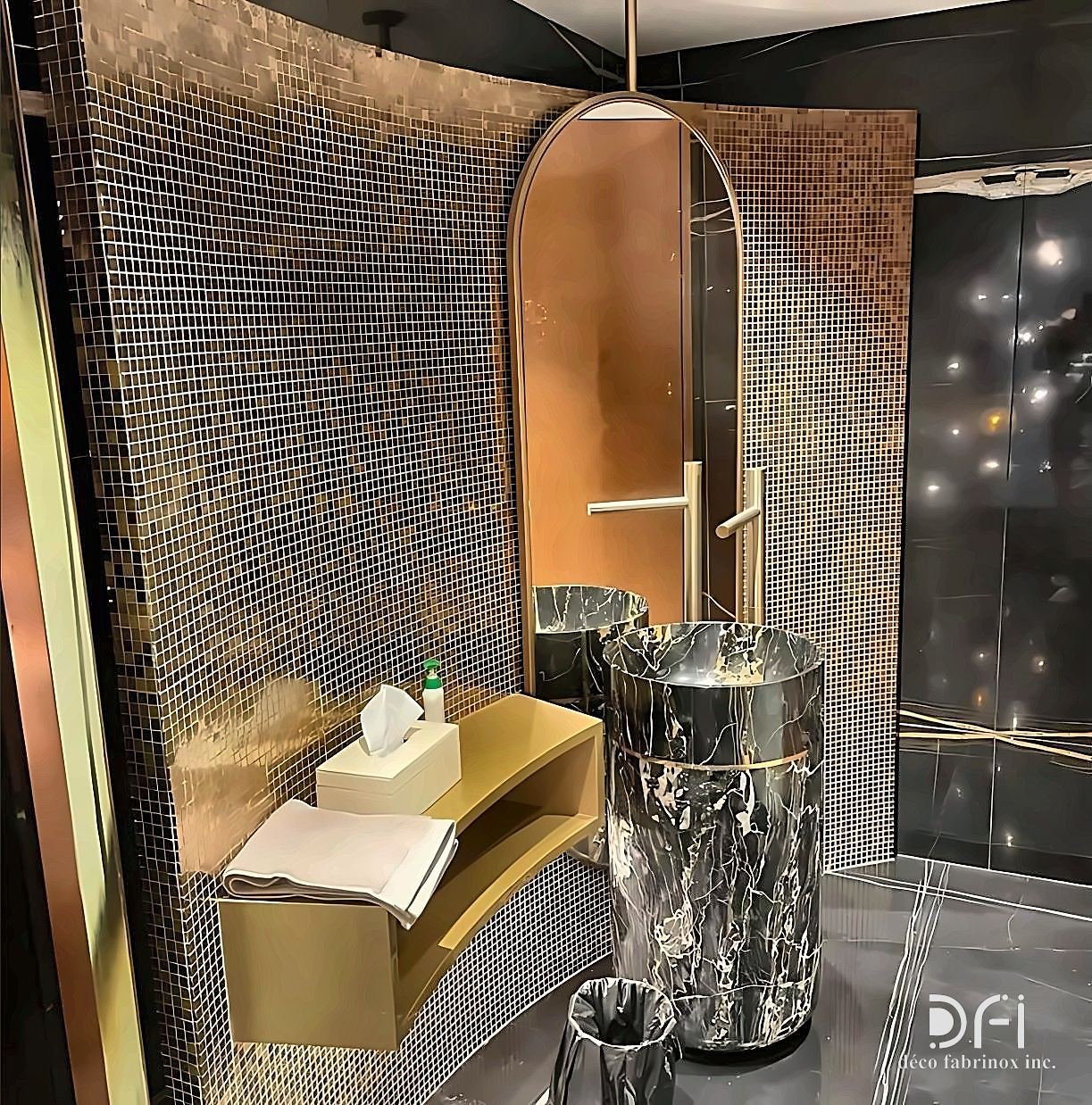 Brass vanity counter in a mosaic-tiled bathroom