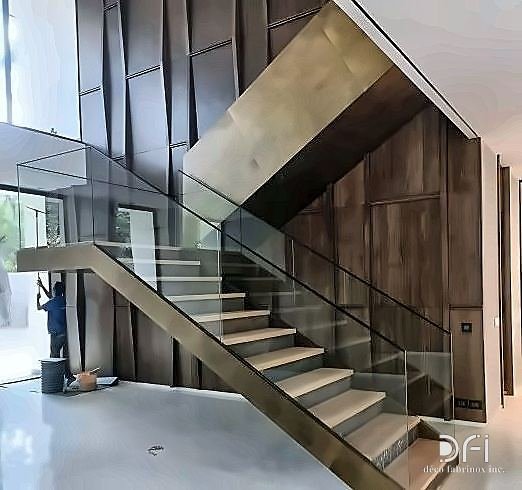 Bronze-clad staircase with a glass balustrade