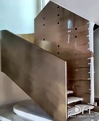 Bronze-clad staircase spine during fabrication