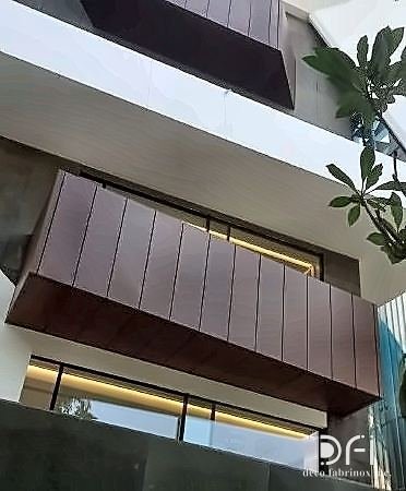 Bronze cladding and soffit detail on a building exterior