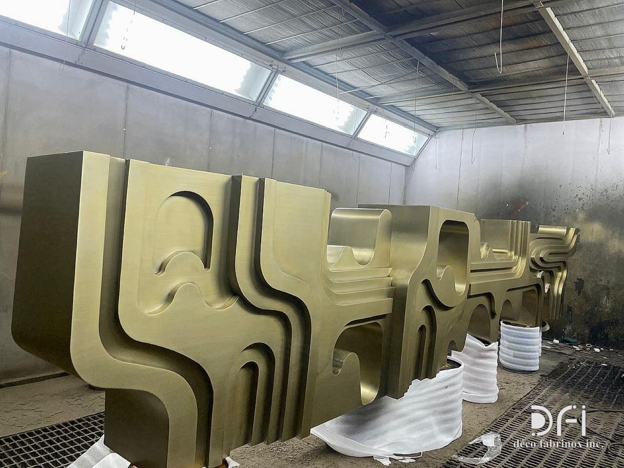 Bronze-finished sculpted console in the spray booth