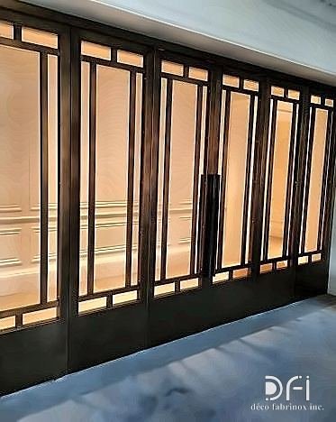 Bronze-framed glazed sliding doors