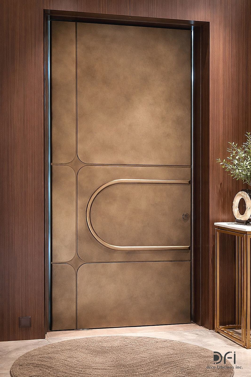 Bronze hotel room door with a U-shaped handle