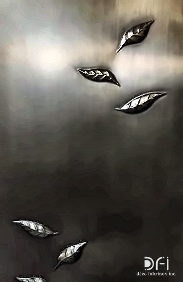 Bronze leaf inlays set into a dark metal panel