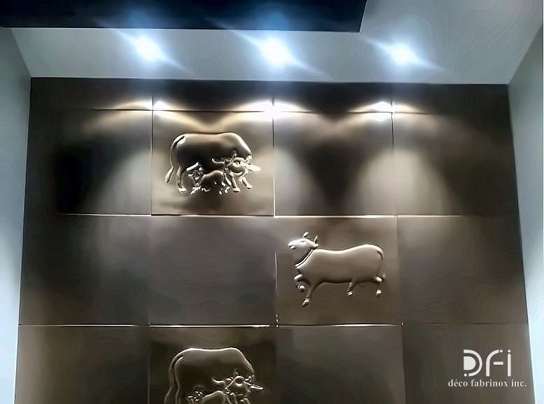 Bronze wall panels with cast animal motifs