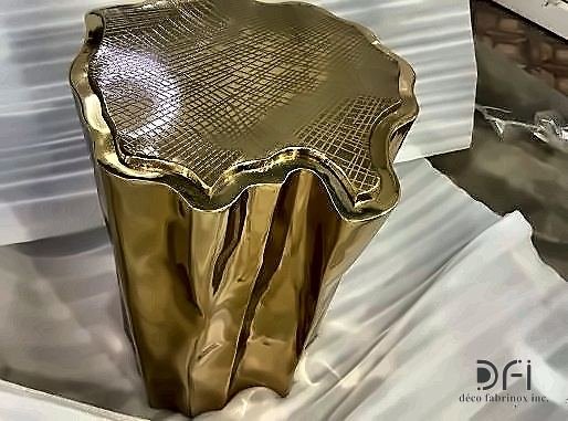 Cast brass side table shaped like a sectioned tree stump