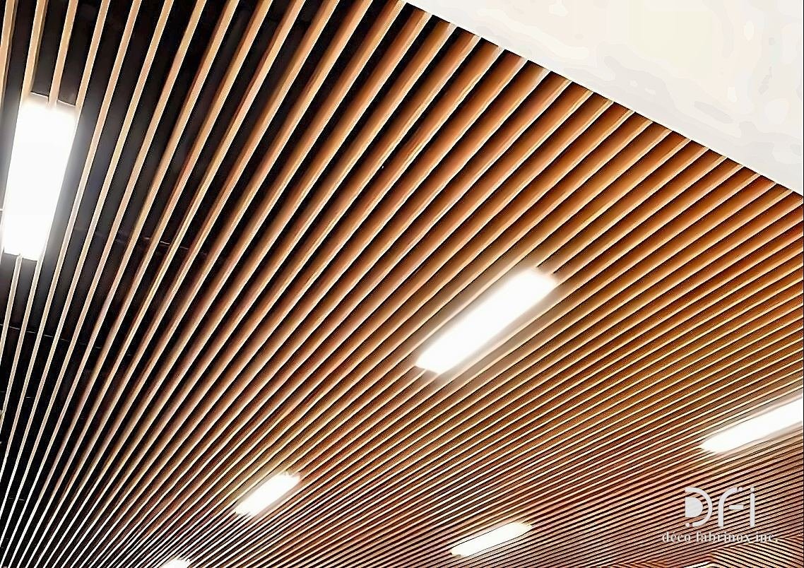 Copper baffle ceiling running the length of a corridor