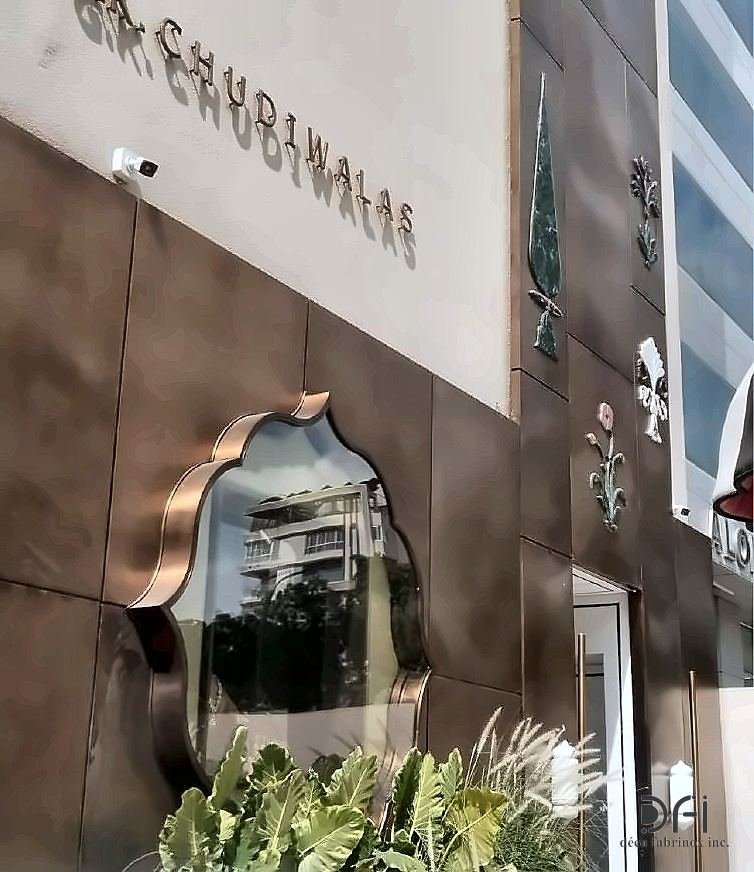Copper facade cladding with a mirrored organic cut-out