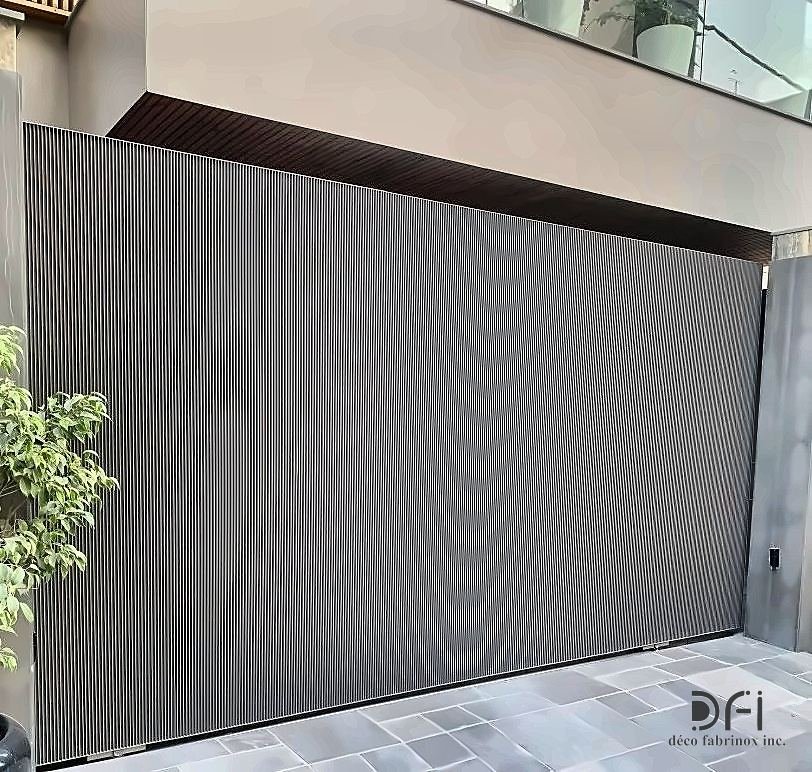 Corrugated metal sliding gate at a residence