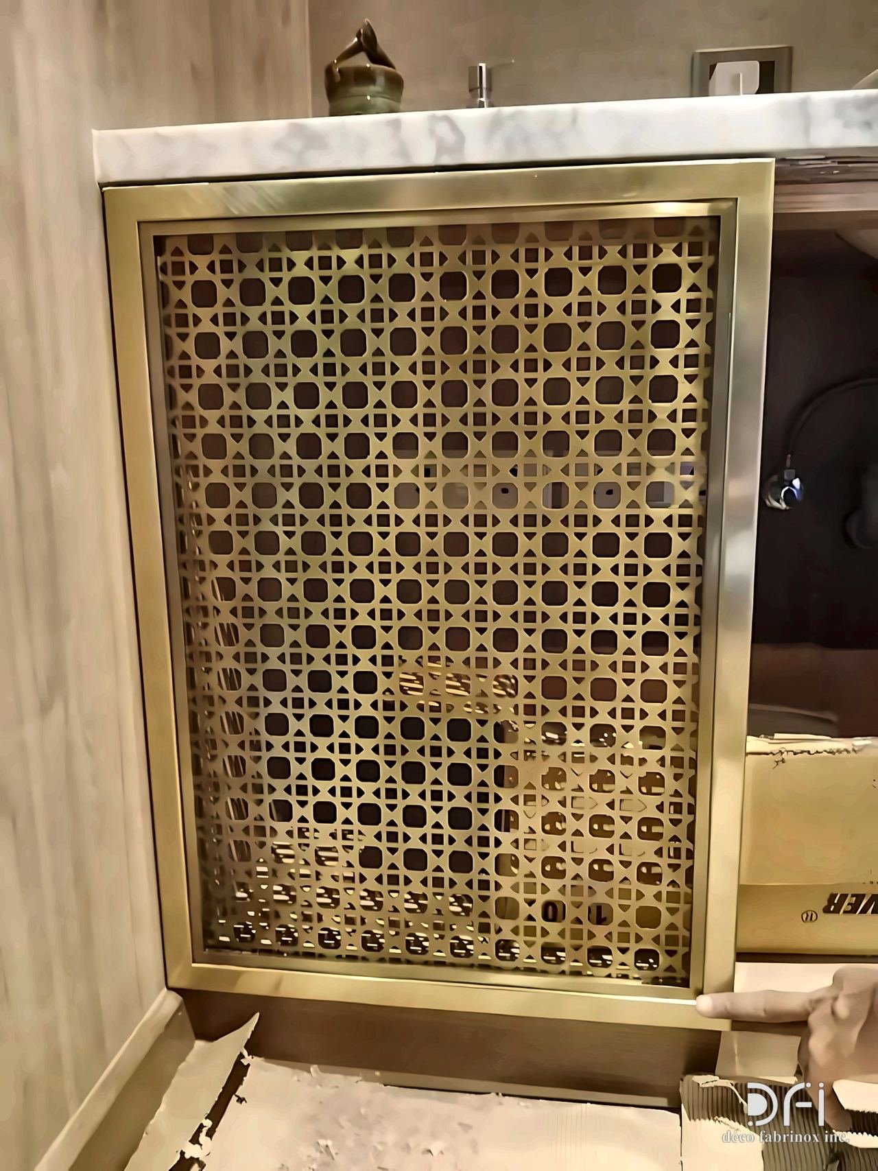 Laser-cut brass lattice panel in a brass frame