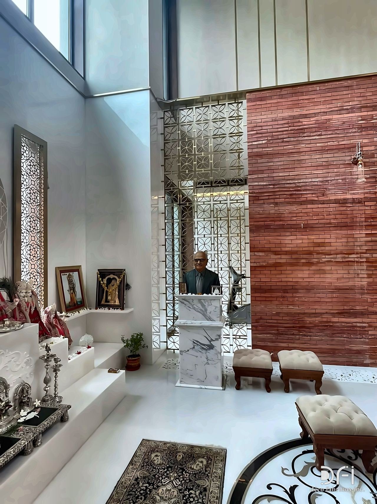 Laser-cut metal screens in a double-height living room
