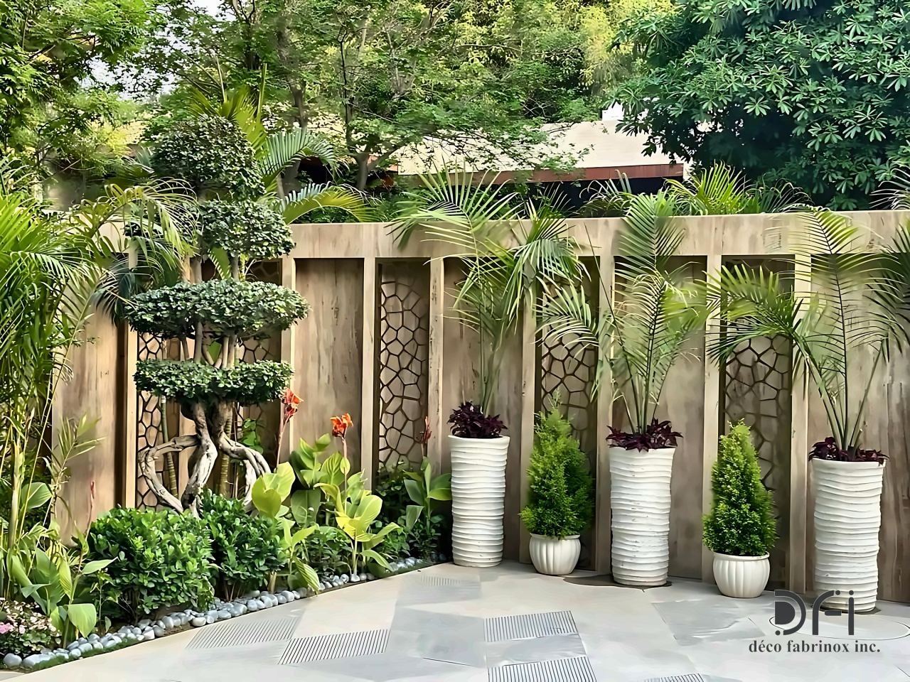 Laser-cut metal panels on a garden boundary wall