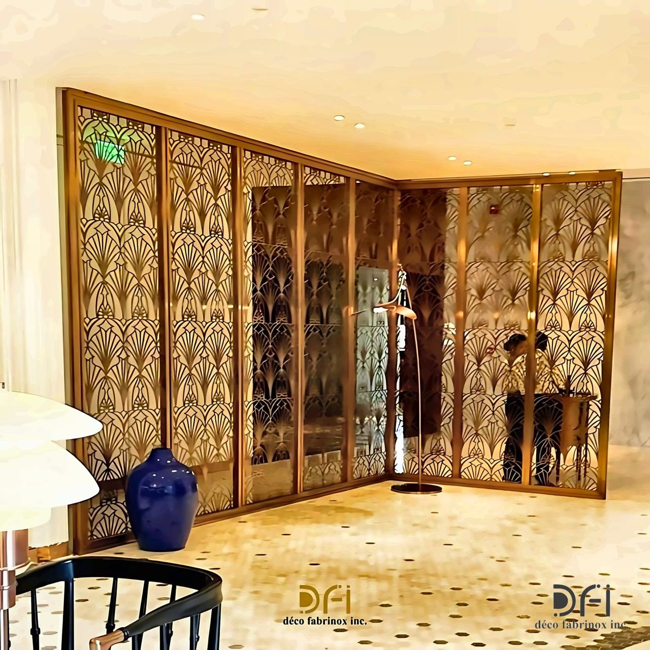 Brass art deco fan-pattern screen across a room corner