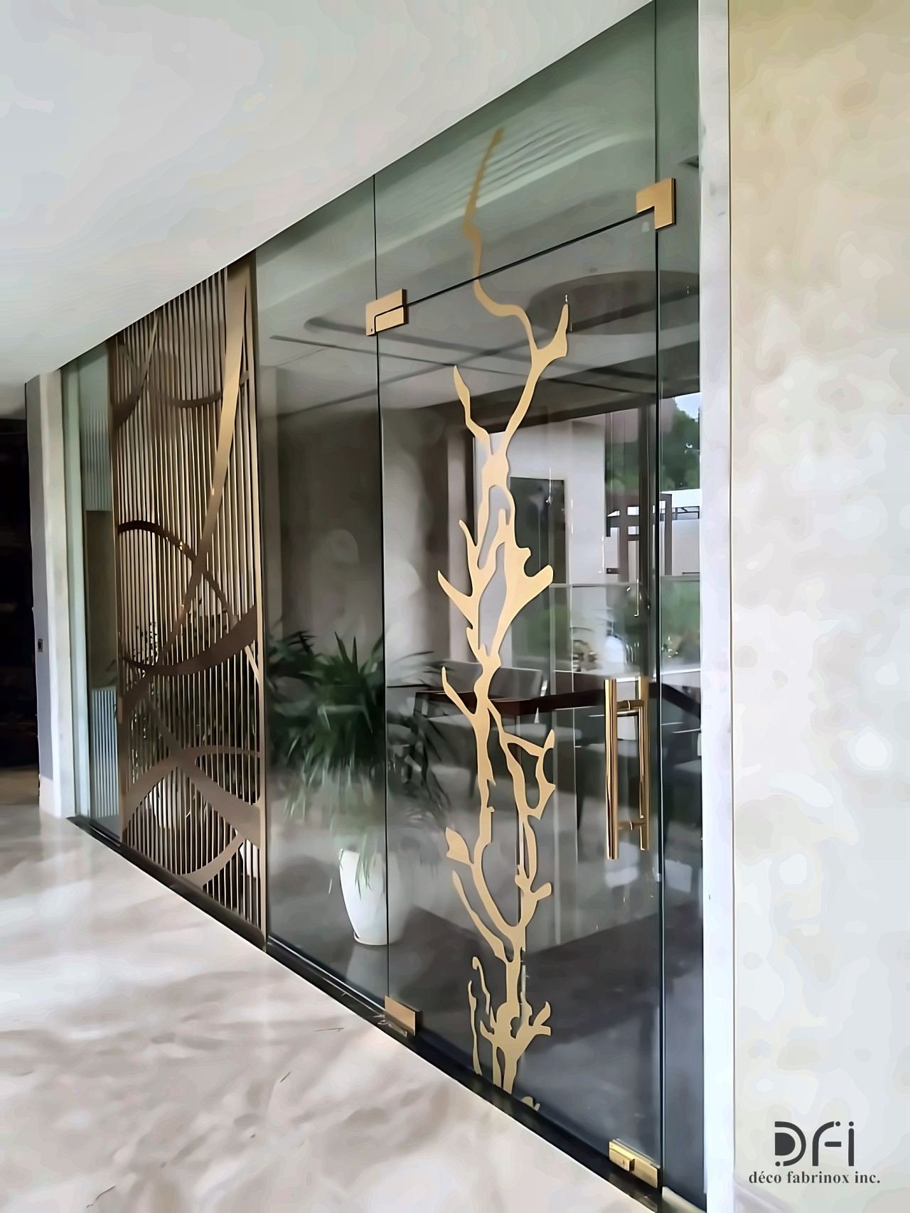 Glass partition with a brass branch motif