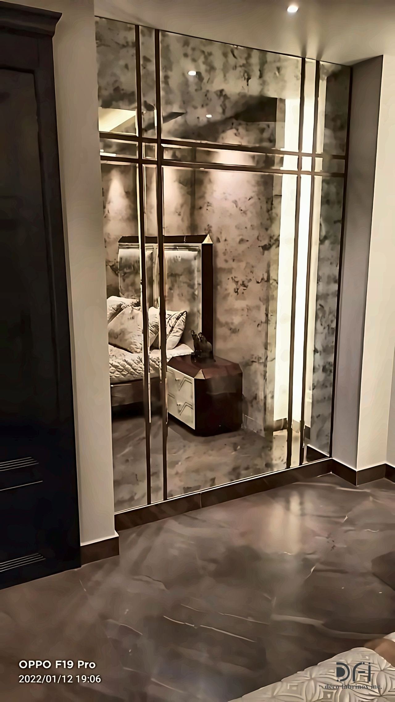 Bronze-framed glass partition with vertical bars