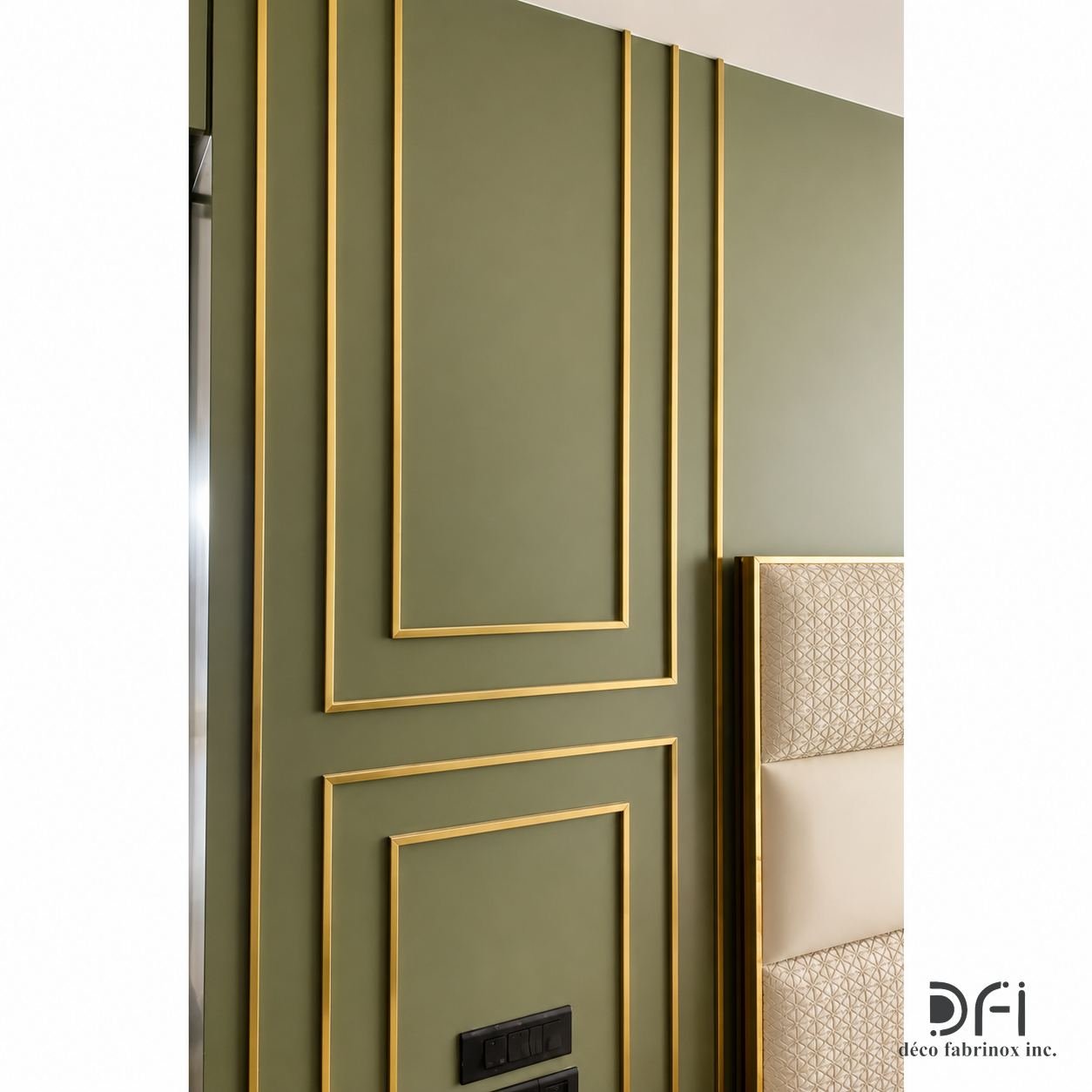 Green wall panel framed with brass inlays