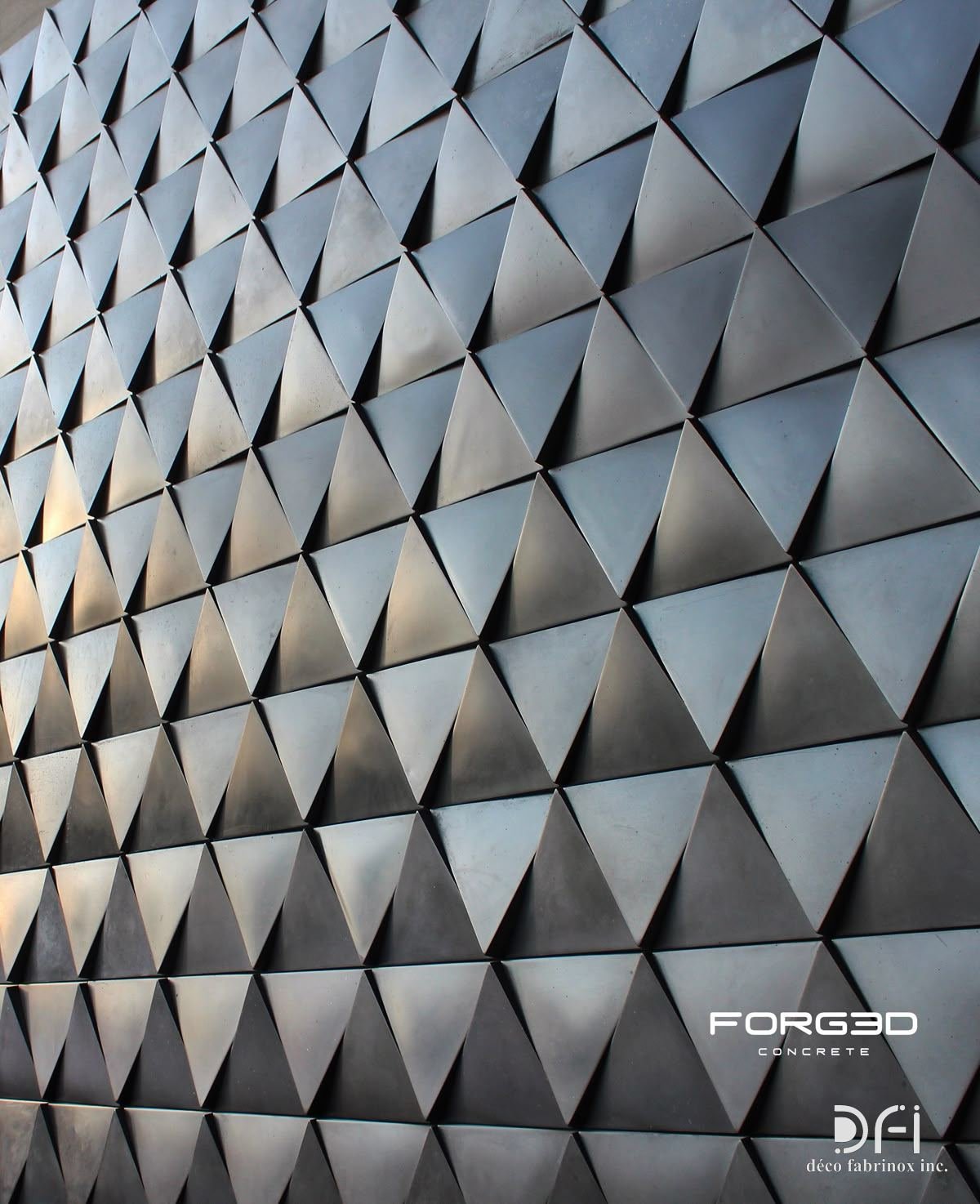 Facade clad in triangular metal panels