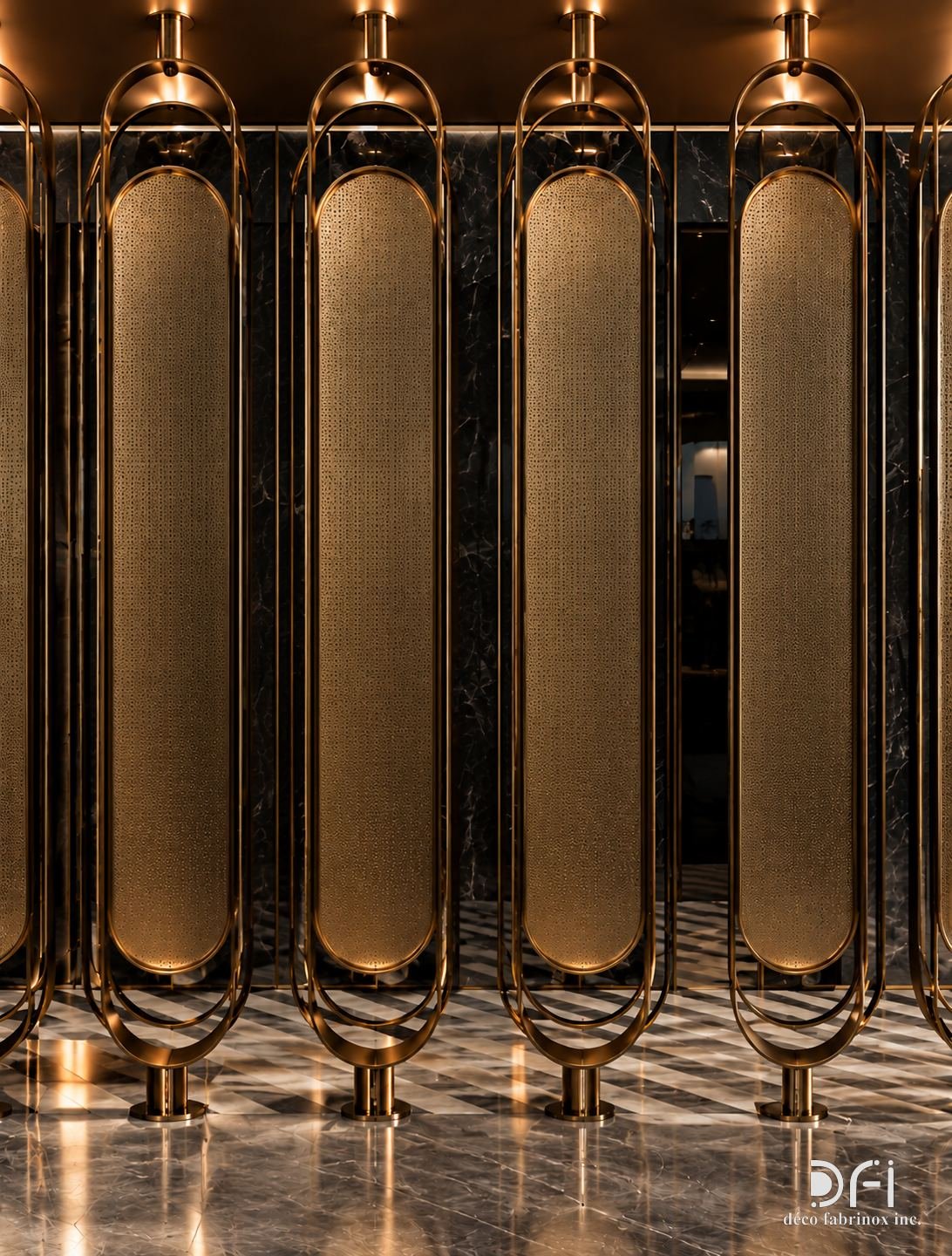 Gold fluted metal screens with arched openings