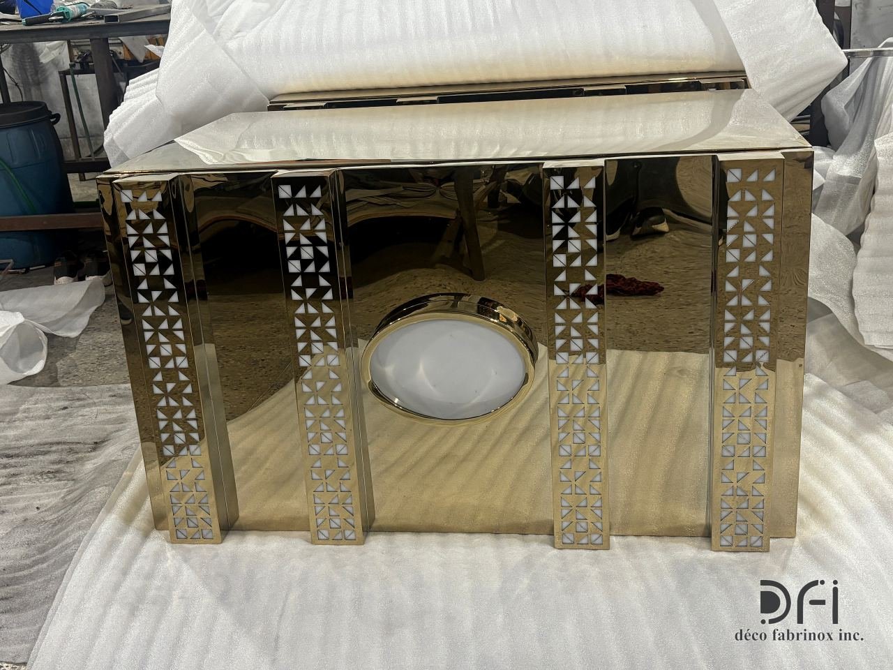 Gold mirror counter with jaali pillars in the workshop