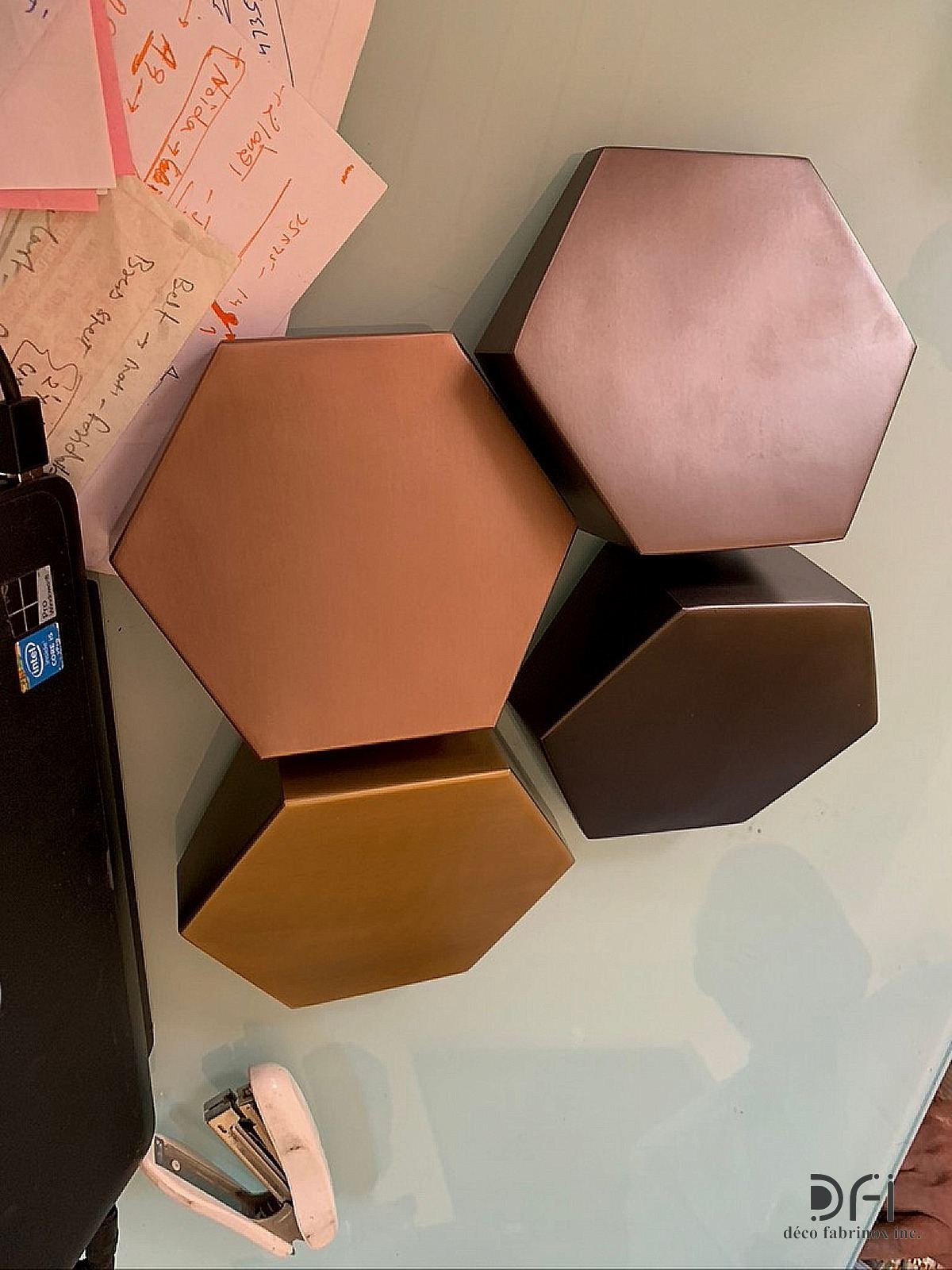 Hexagonal metal samples in copper, bronze and brass patinas