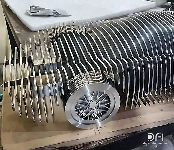 Laser-cut steel sculpture of a car built from stacked profiles