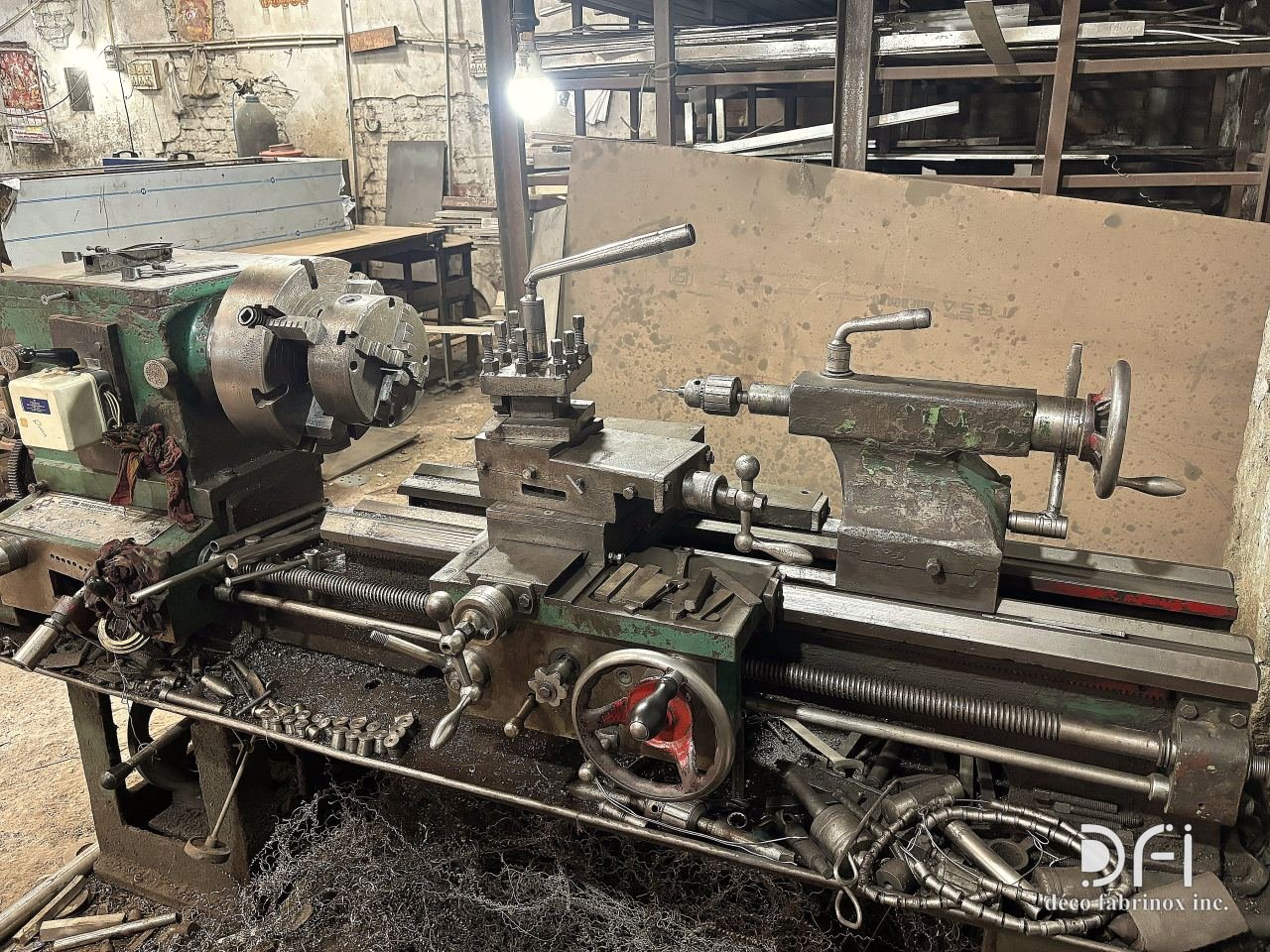 Lathe turning a metal component in the DFI workshop
