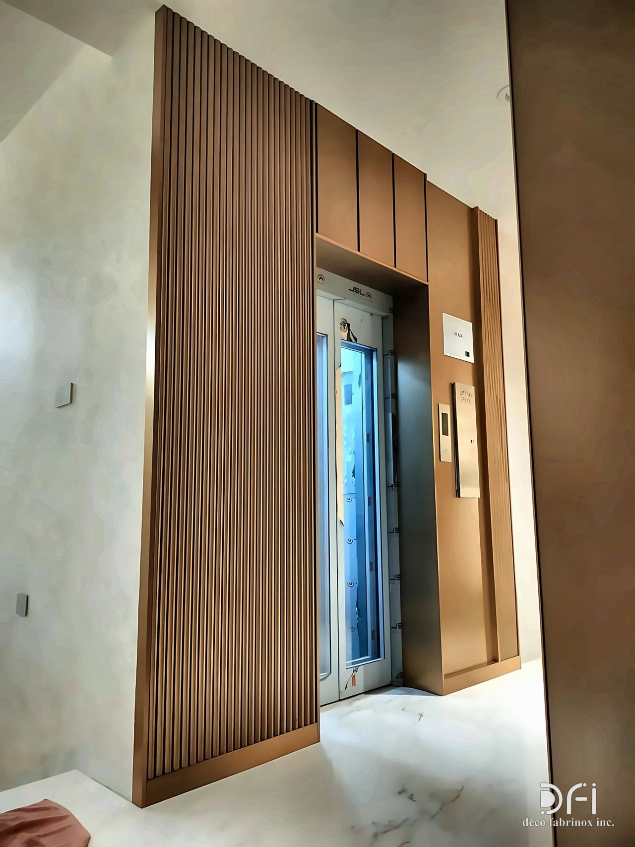Bronze slatted feature wall around a lift door