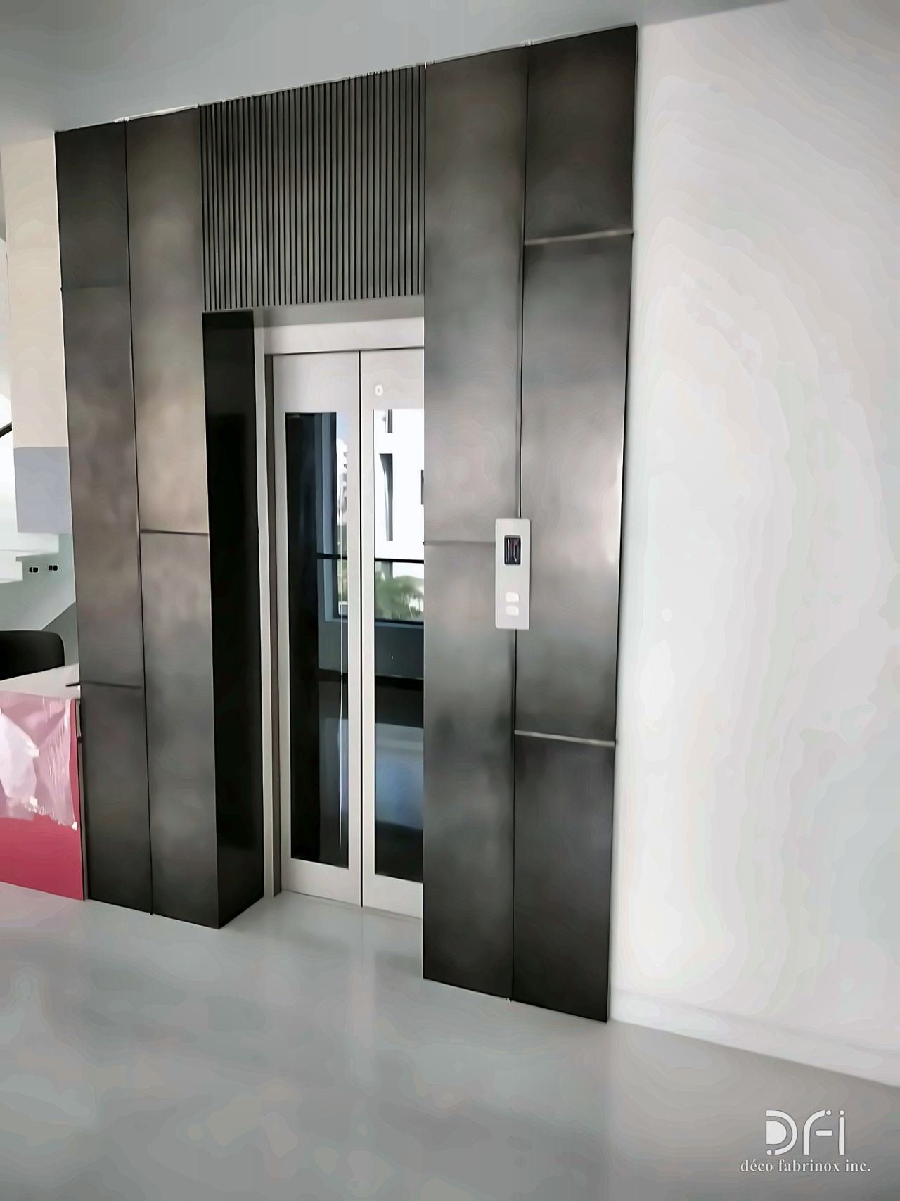 Blackened steel cladding framing a lift entrance