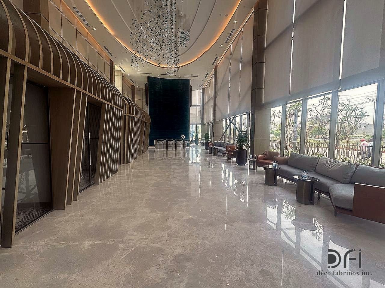 Long lobby with arched slatted metal ribs and lounge seating