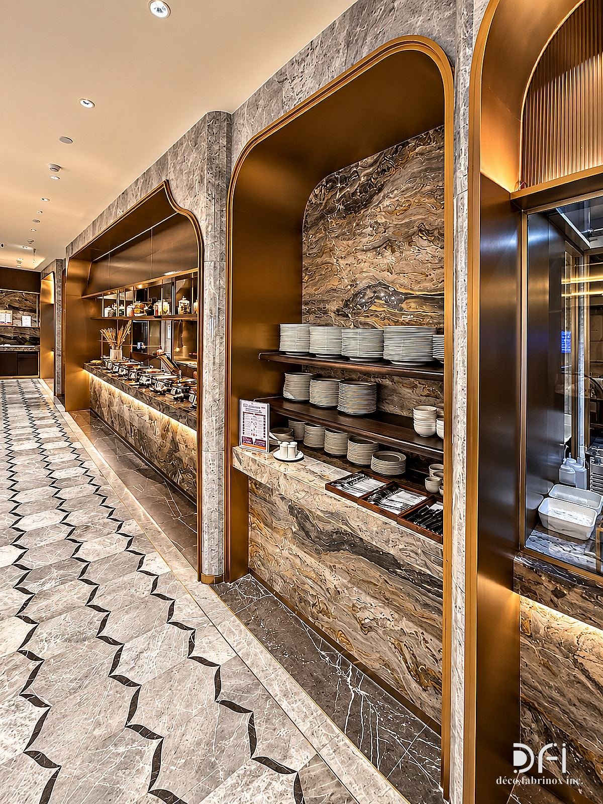 Brass arch with lit shelving along a marble buffet