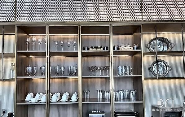 Metal display joinery behind a bar counter
