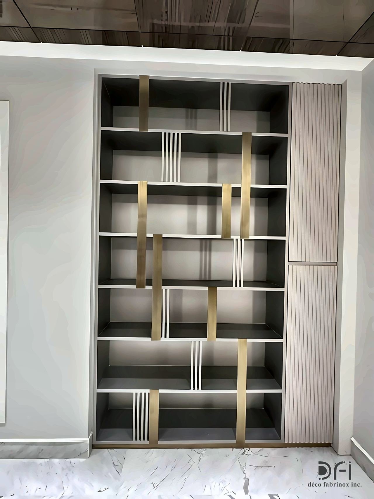 Built-in shelving with brass verticals in a residence