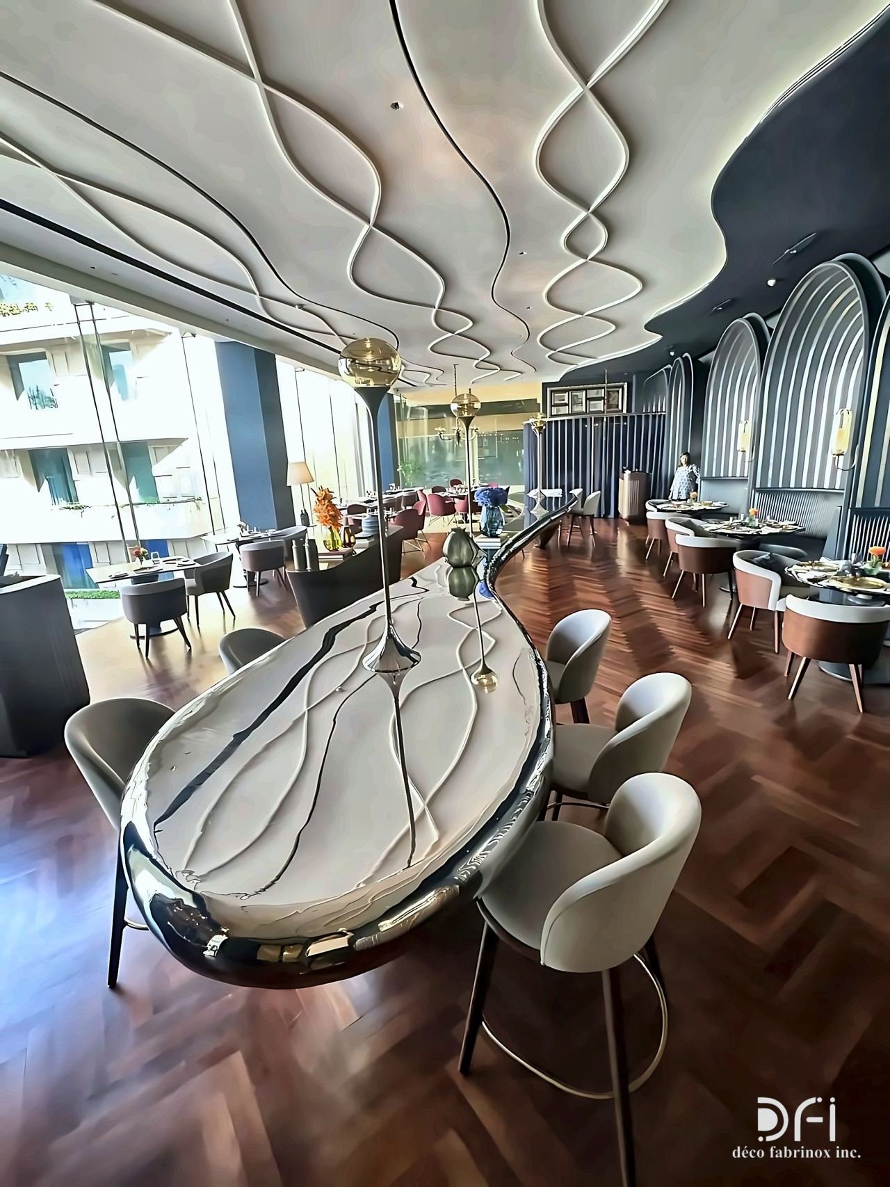 Flowing metal ceiling ribbons above a polished dining table