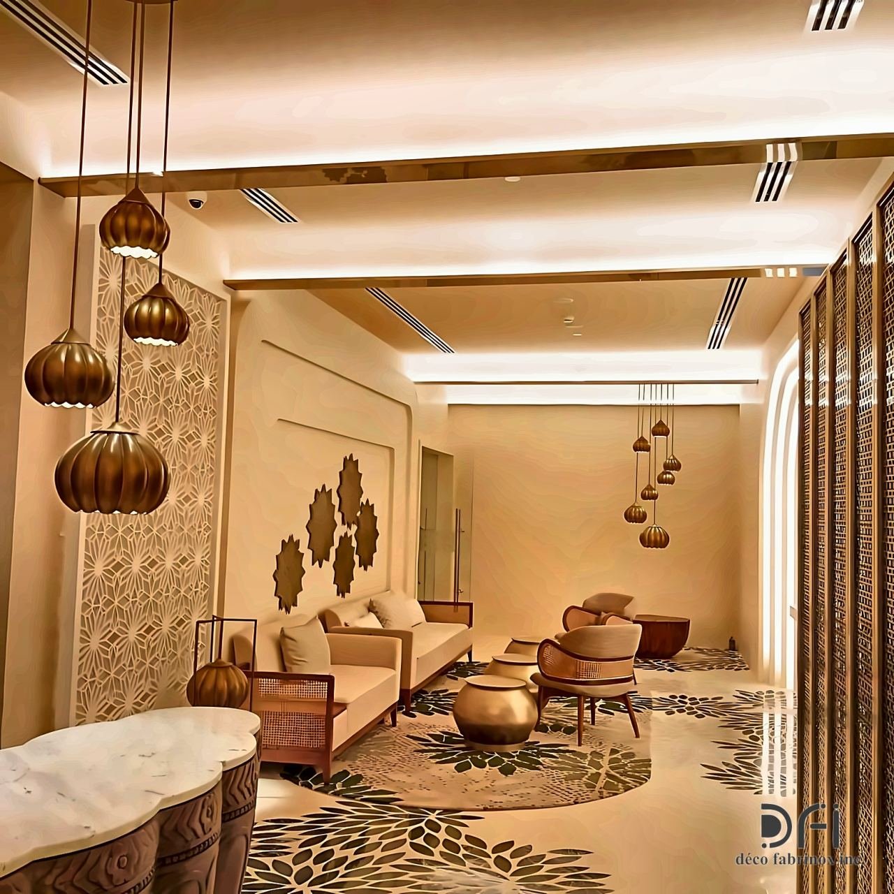 Perforated brass screens and pendant lights in a hotel lounge