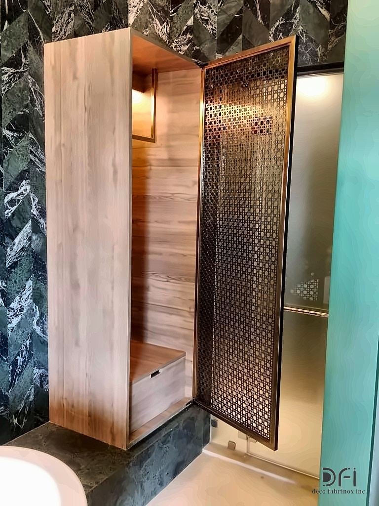 Perforated metal door on a timber wardrobe unit
