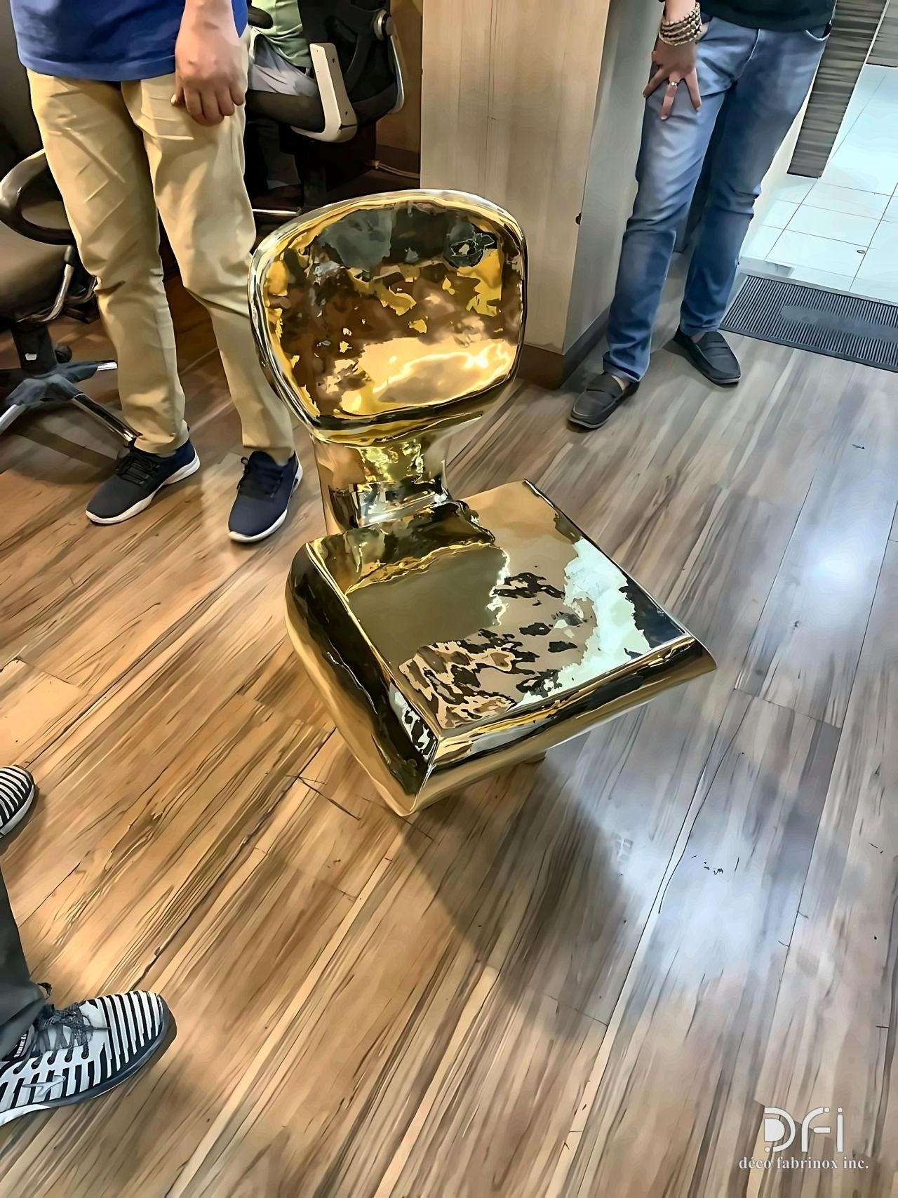 Gold-finished sculptural chair base during inspection