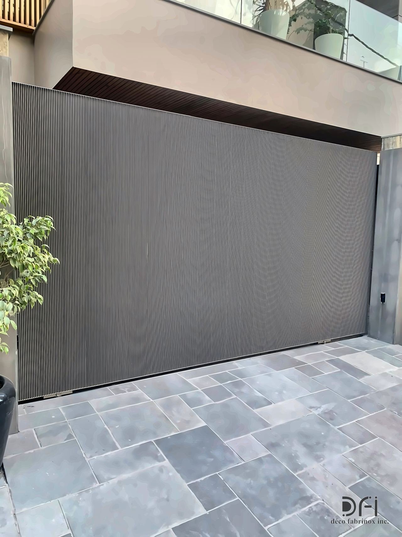 Ribbed grey metal sliding gate