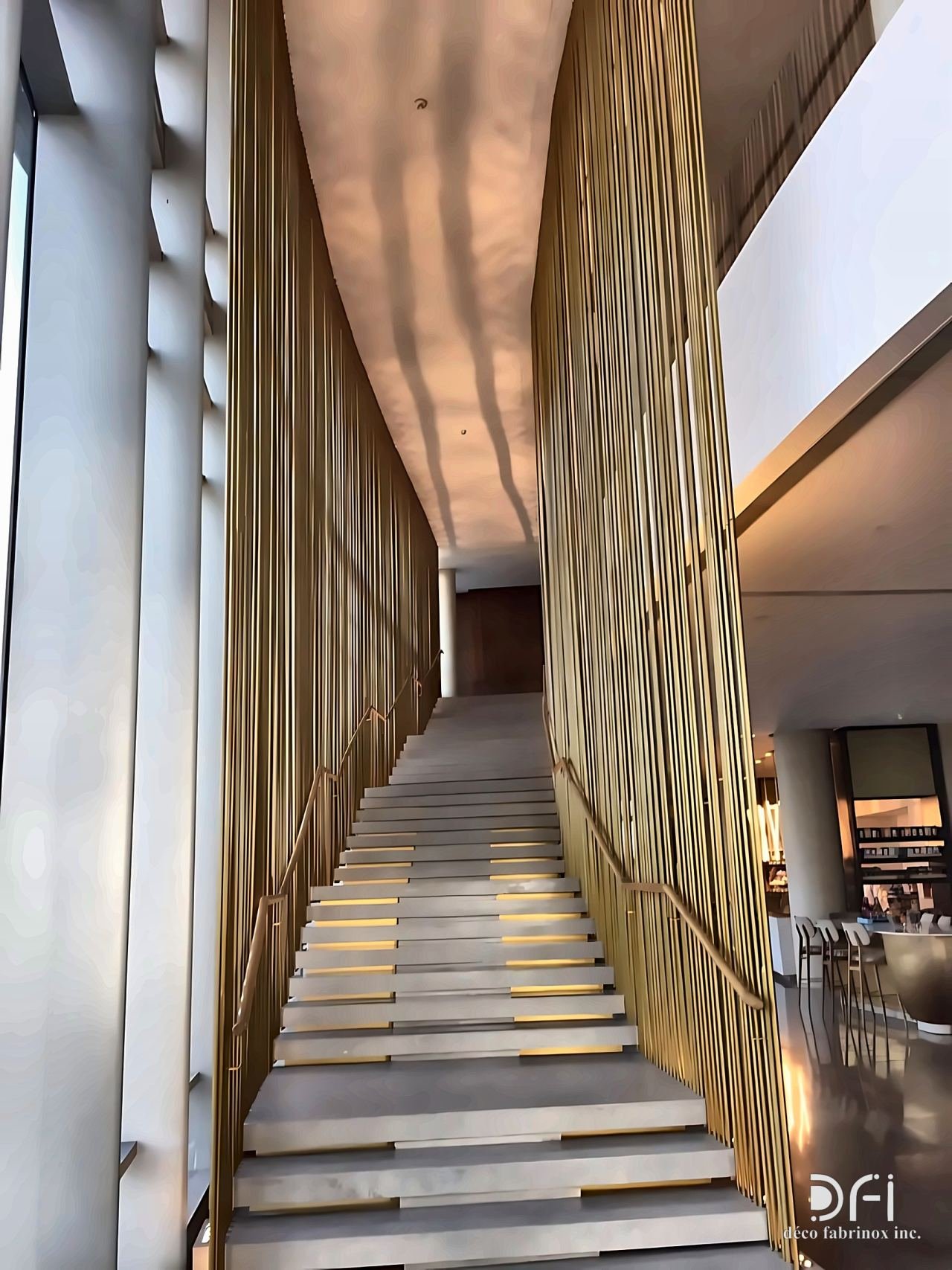 Brass vertical rods along a long staircase