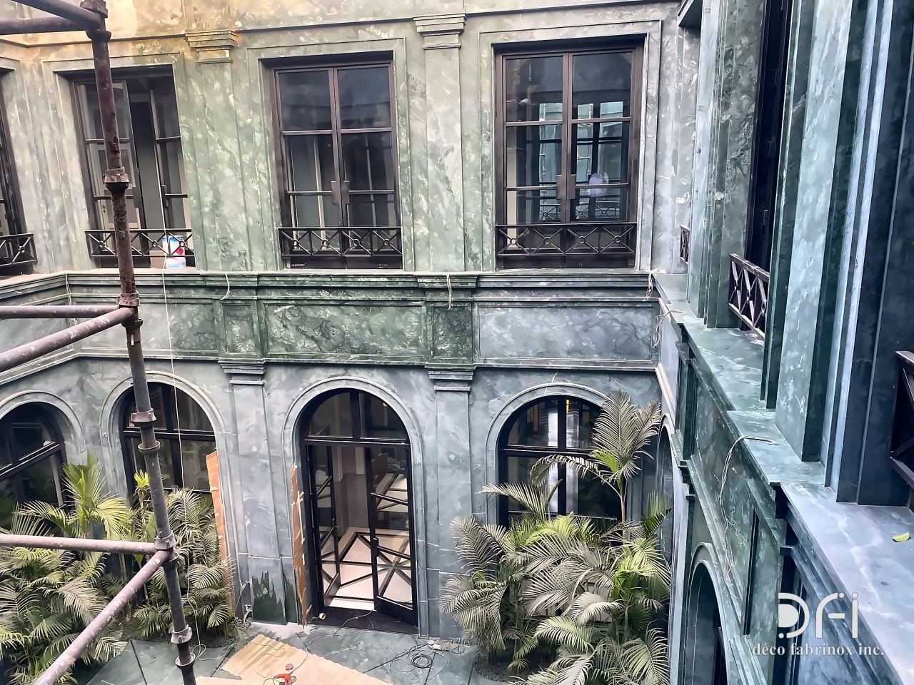 Black metal balconies in a courtyard facade