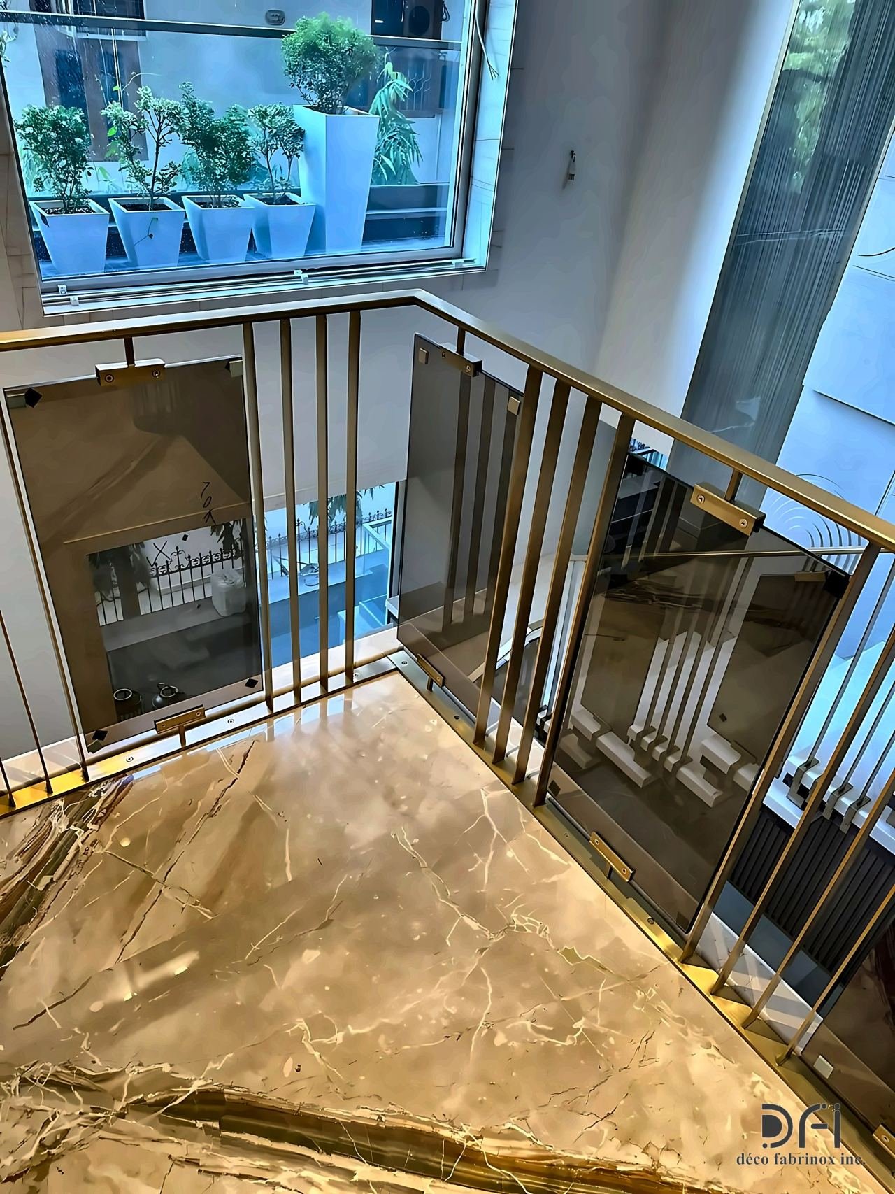 Brass-framed glass balustrade around a stair landing