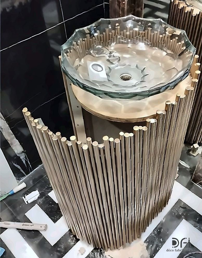 Metal rod pedestal supporting a glass vanity basin