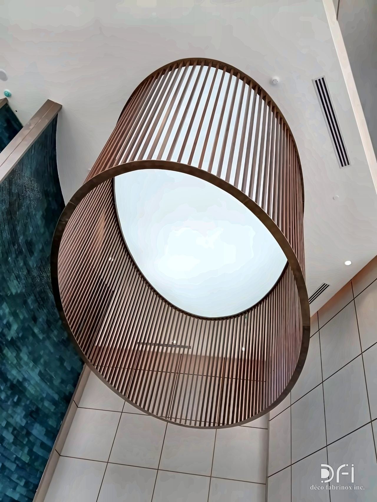 Cylindrical bronze-slatted pendant light frame