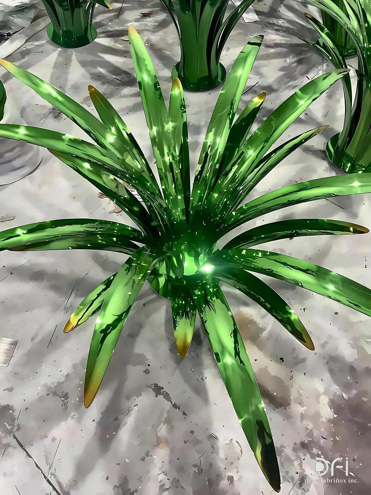 Glossy green metal plant sculptures in a planter