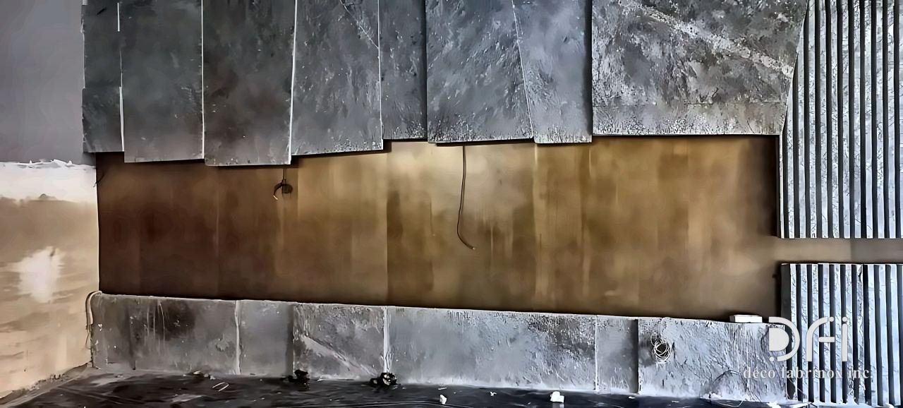 Brass band set between textured stone wall panels